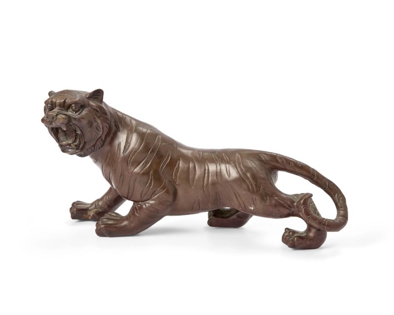 A Japanese bronze okimono of a tiger