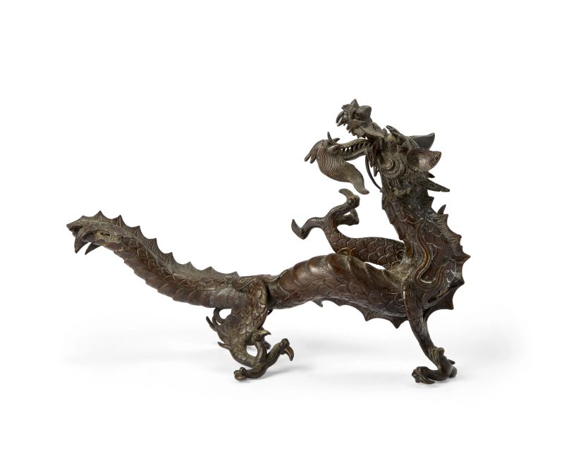 A Japanese bronze okimono of a dragon
