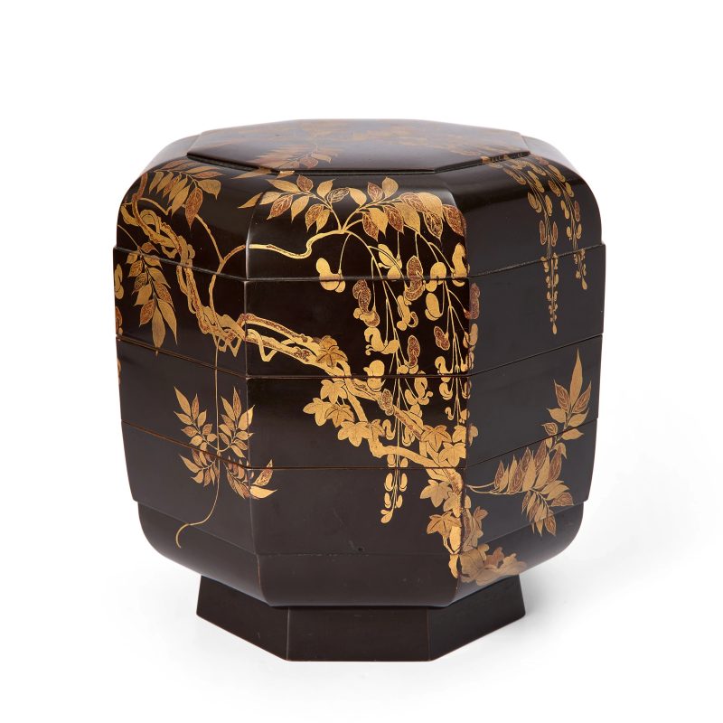 A Japanese lacquer octagonal three-tiered box and cover